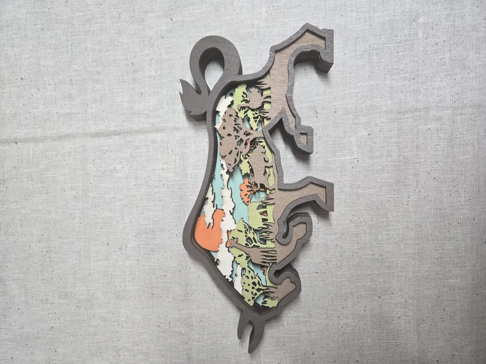 Layered Wooden Bull Silhouette with Western Sunset Scene